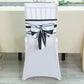 Black and white striped satin chair sash on a white chair.
