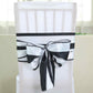 Black and white stripe satin chair sash on a white chair.