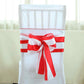Red and white stripe satin chair sash on a white chair.