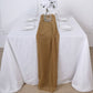 Gold chiffon table runner on a white table setting.
