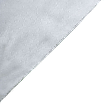 Silver chiffon table runner on a white surface.