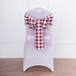 Burgundy and white checkered chair sash tied on a chair.