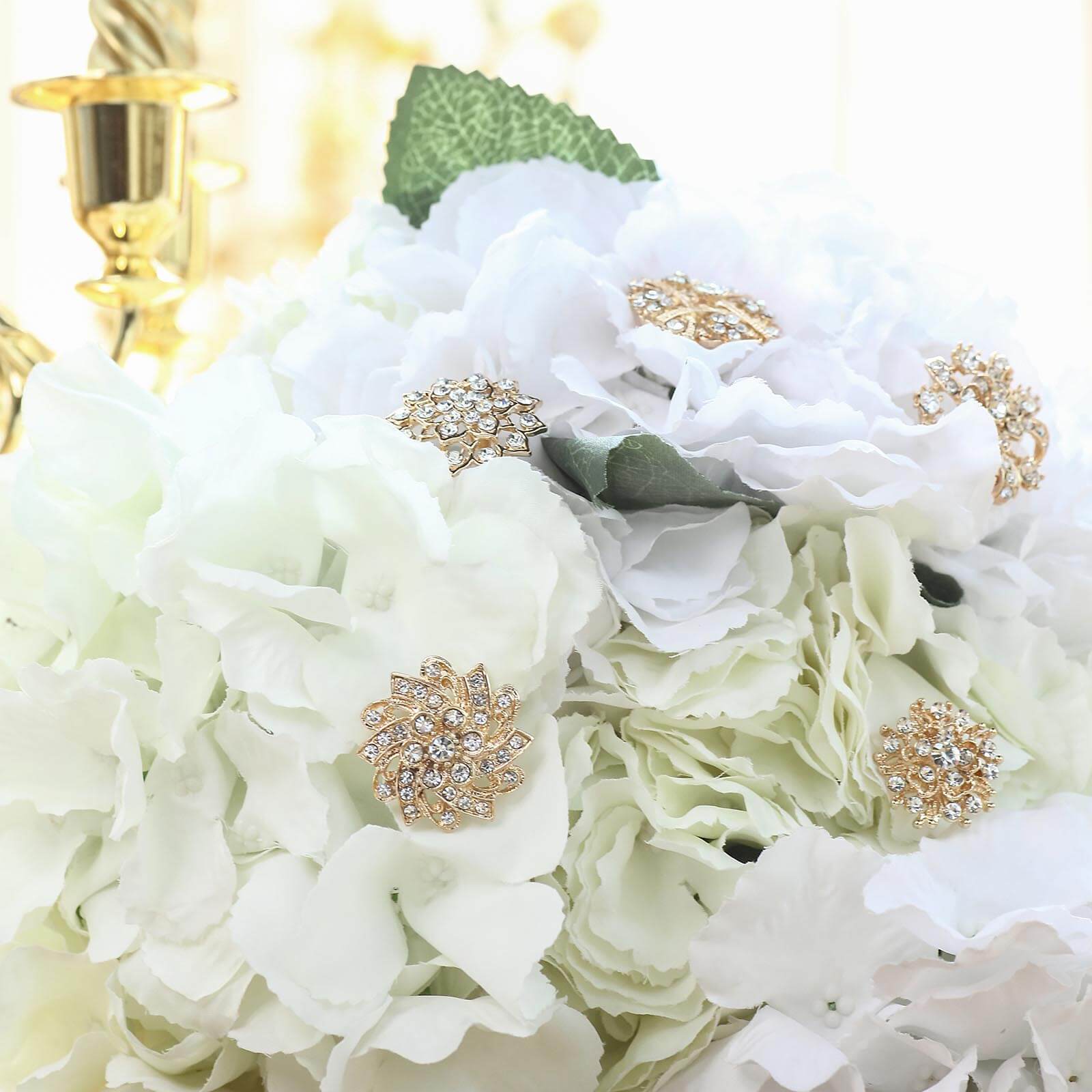 Gold plated mandala brooches with rhinestones on floral bouquet decor.