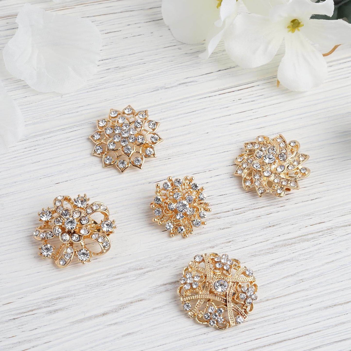 Gold plated mandala crystal rhinestone brooches for floral decor.