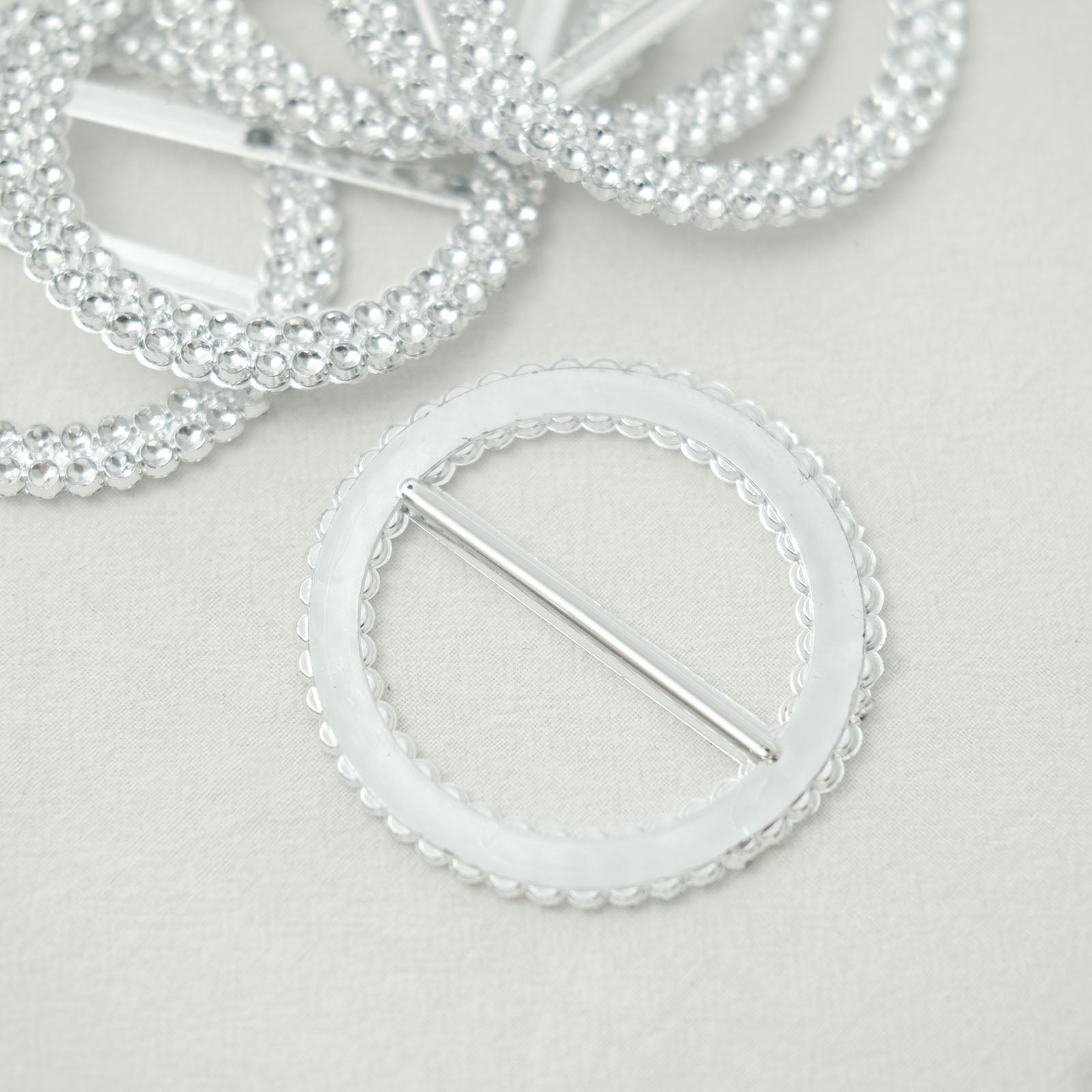 Silver diamond circle chair sash band buckle pin set.