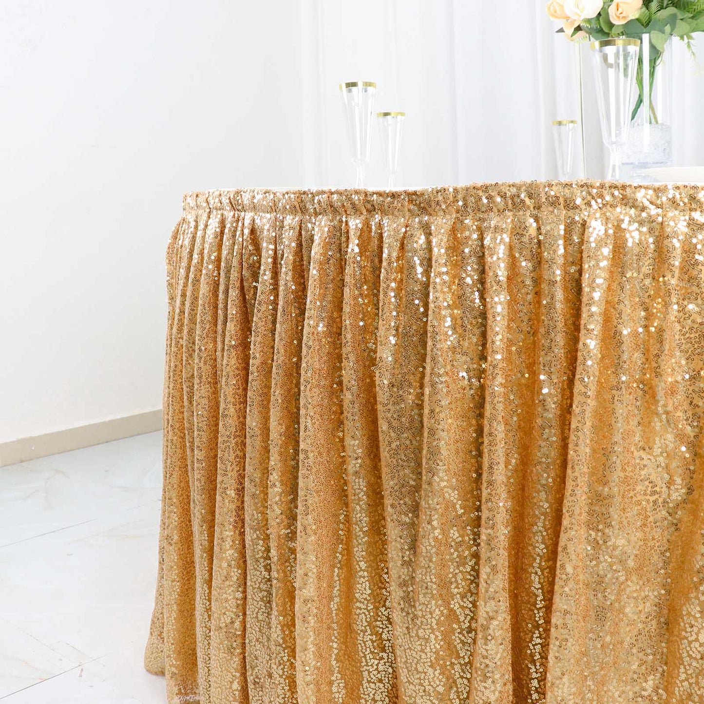 Sparkly gold sequin pleated satin table skirt with velcro strip.