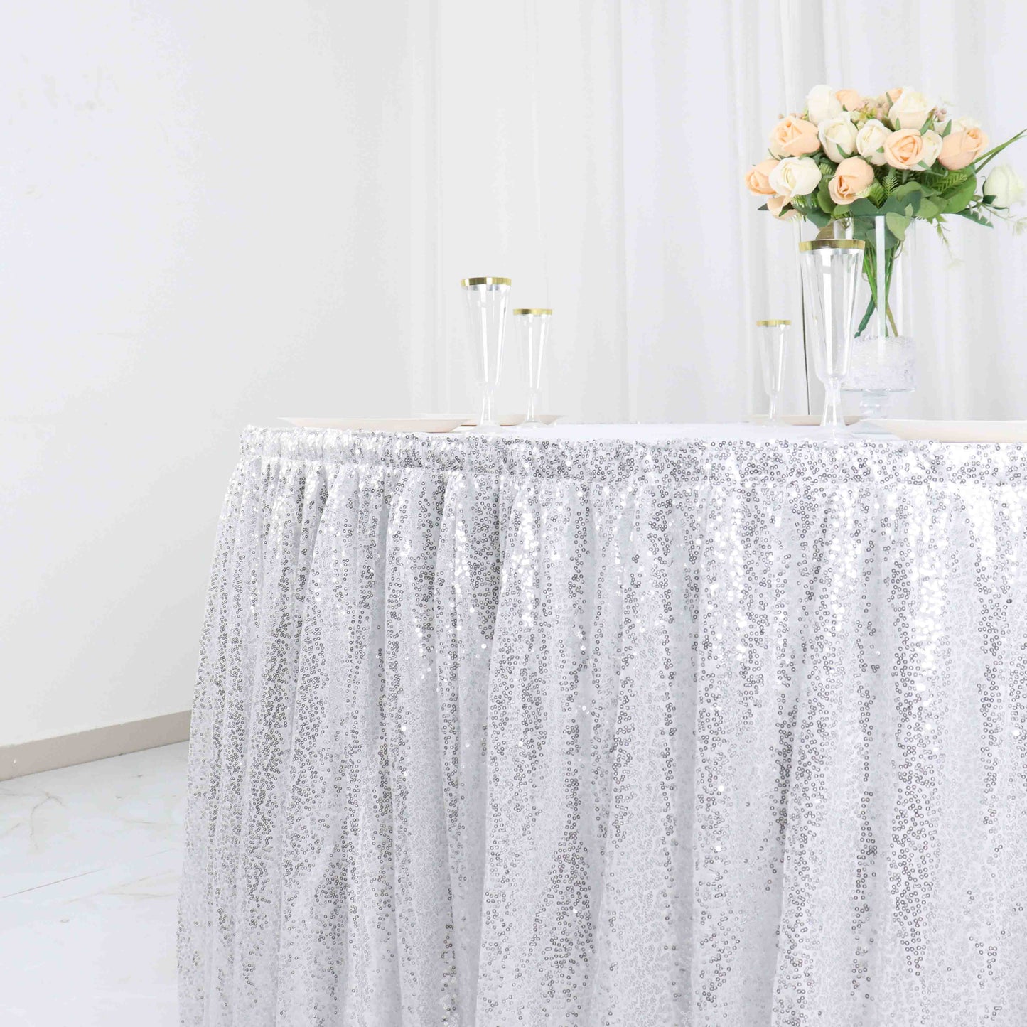Sparkly silver sequin pleated satin table skirt with top Velcro strip.