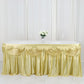 Champagne pleated satin table skirt draped elegantly on a table.