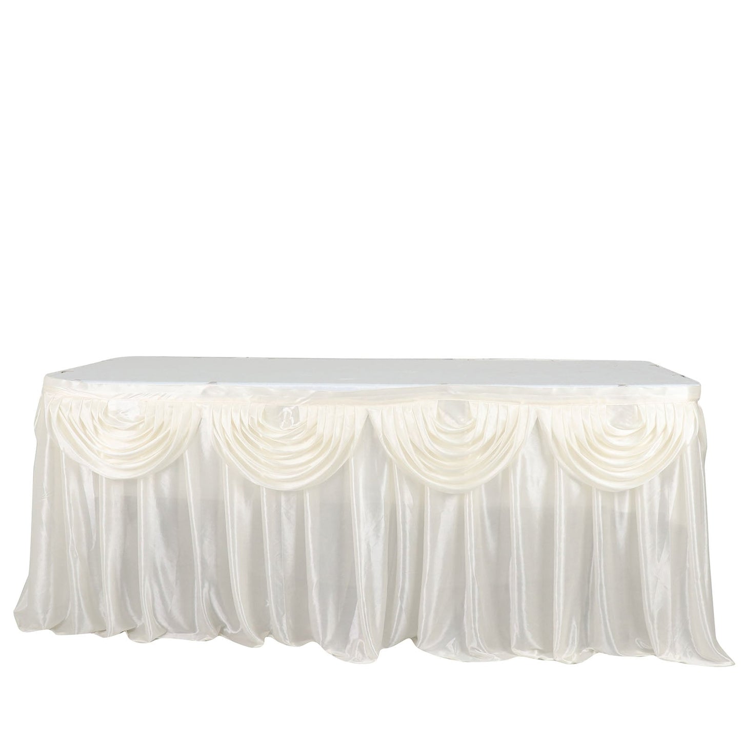Ivory pleated satin table skirt draping elegantly over a rectangular table.