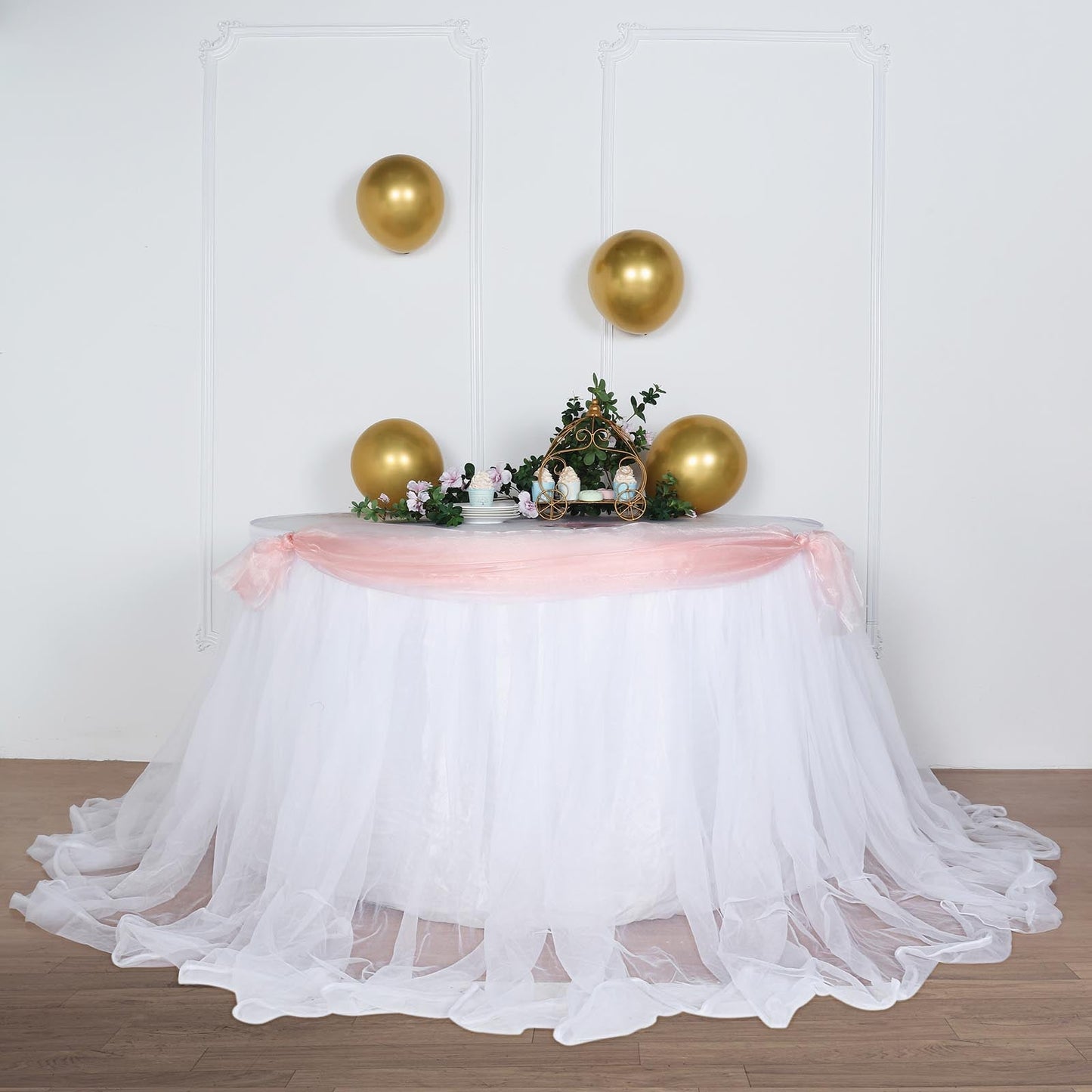 White tulle and satin table skirt for elegant party decor.