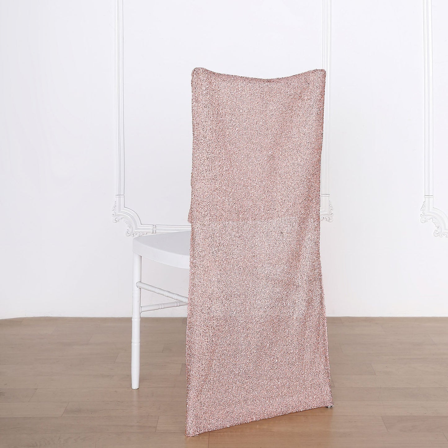 Rose gold metallic shimmer tinsel spandex stretch chair slipcover on white chair.
