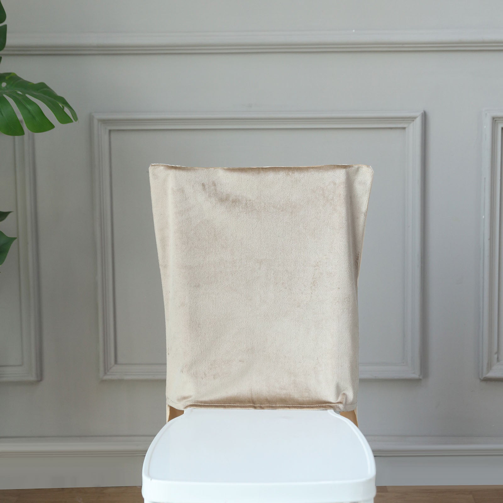 Champagne velvet Chiavari chair back slipcover for elegant decor.