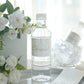 White and gold waterproof water bottle label "Cheers!" for weddings.
