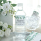 White and green water bottle label with leaves design, "Thank You" message.
