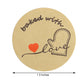 Baked with love sticker in brown and red, perfect for bakery packaging.