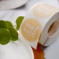 Yellow handmade stickers roll for cookie and bakery boxes.