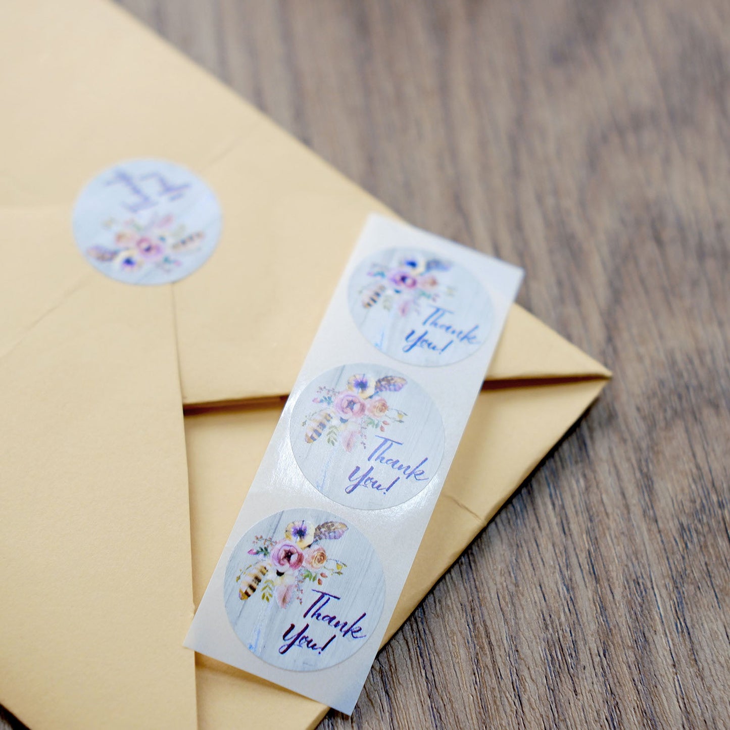 Rustic floral boho chic thank you stickers on envelope seal.