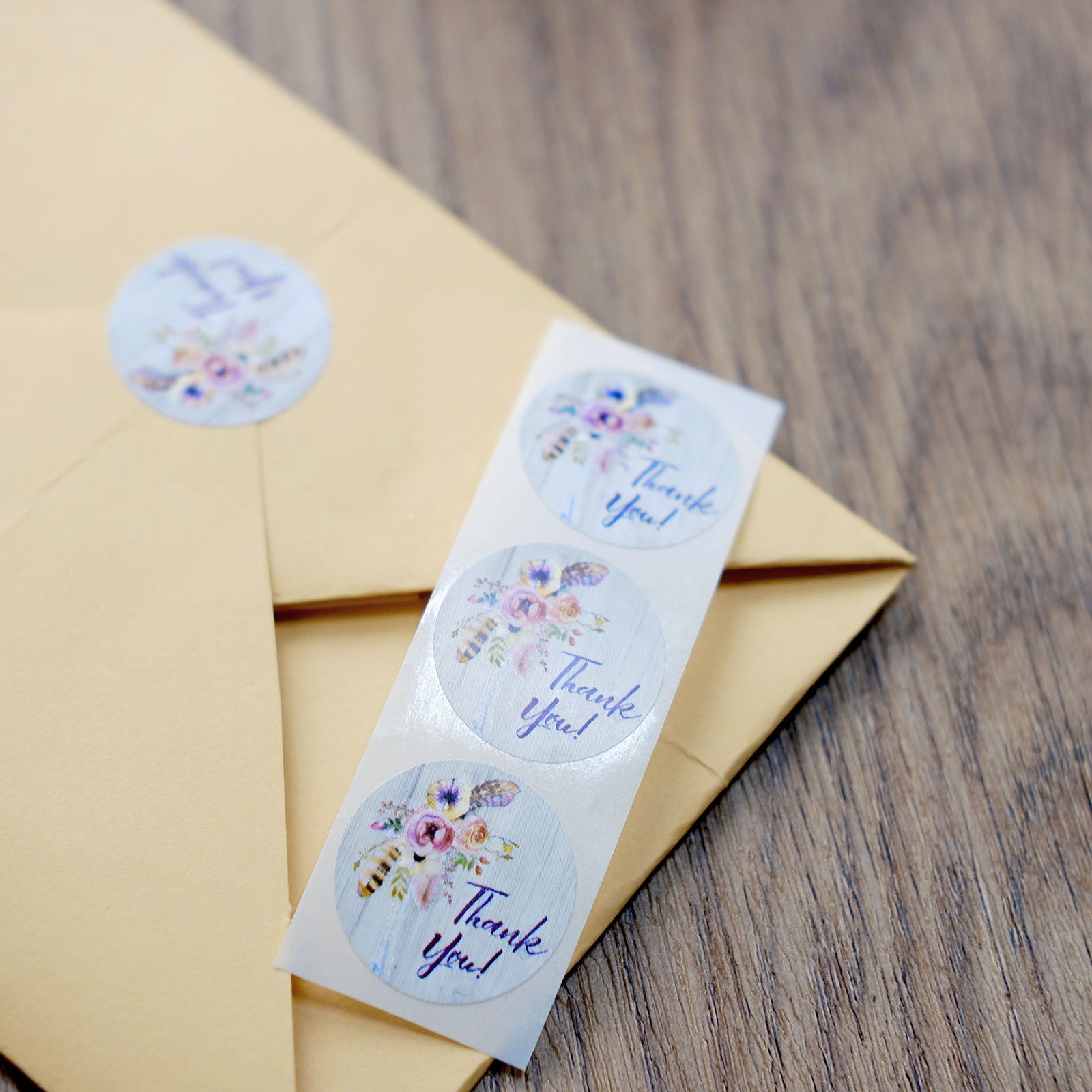 Rustic floral boho chic thank you stickers on envelope seal.