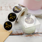 Black round stickers with gold foil "Thank You" text for DIY decor.