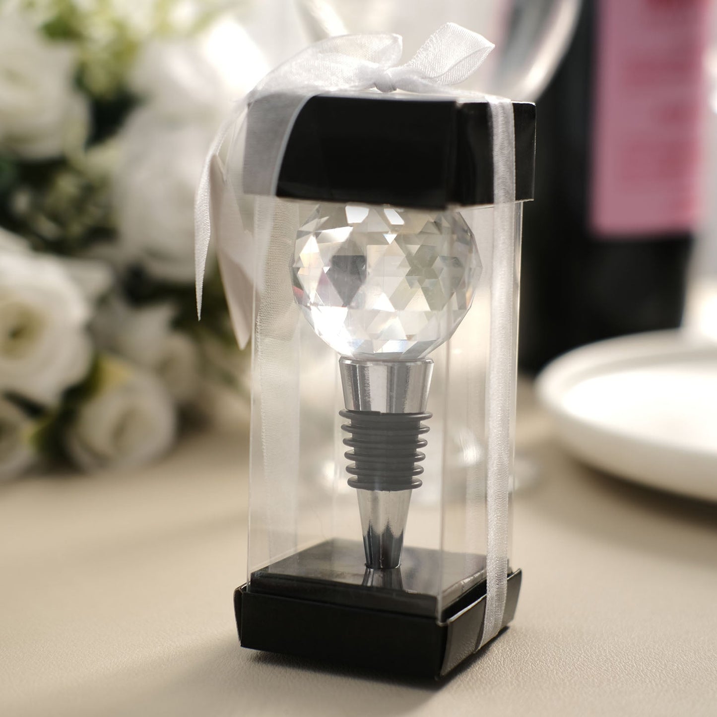 Clear crystal glass ball wine bottle stopper in a gift box with ribbon.