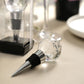 Clear crystal glass ball wine bottle stopper with metal base in a gift box.