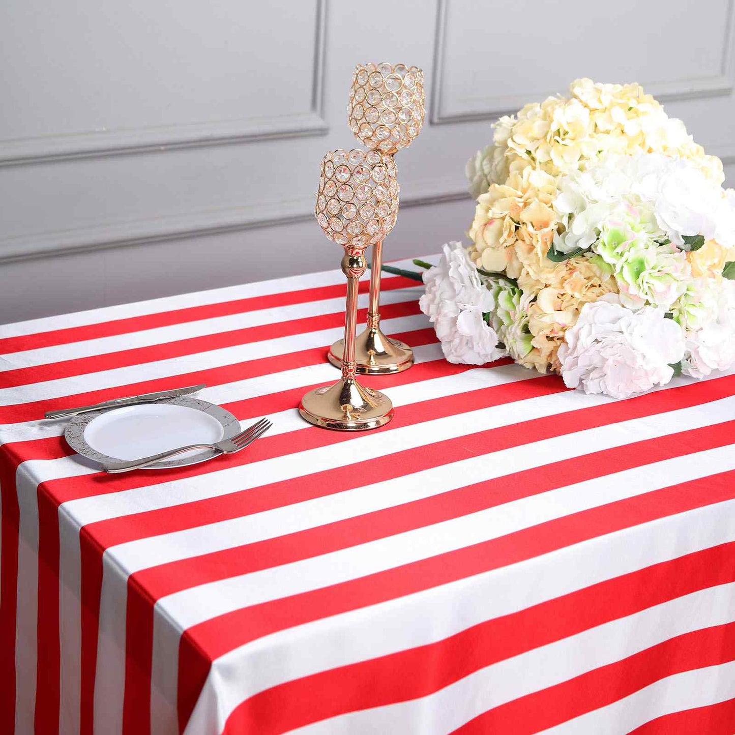 Red and white seamless stripe satin tablecloth on a dining table.