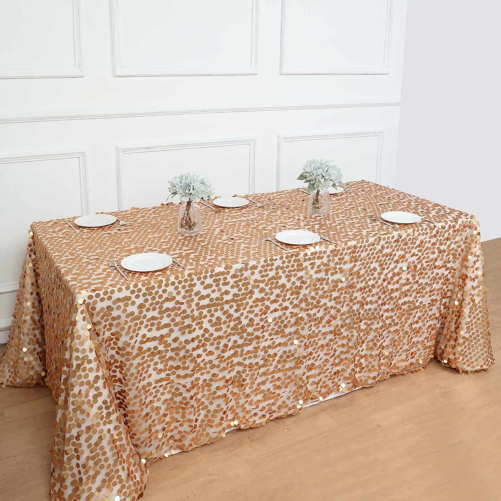 Matte champagne big payette sequin tablecloth on a rectangular table.
