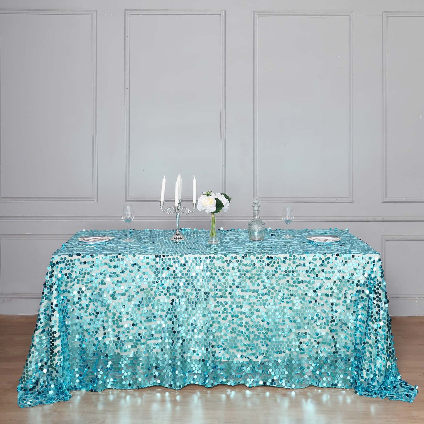 Turquoise sequin rectangle tablecloth for elegant event decor.