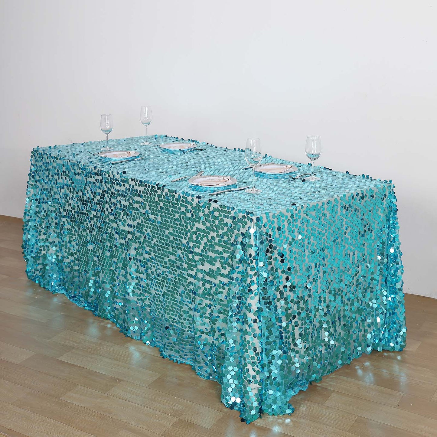 Turquoise sequin tablecloth for events and celebrations.