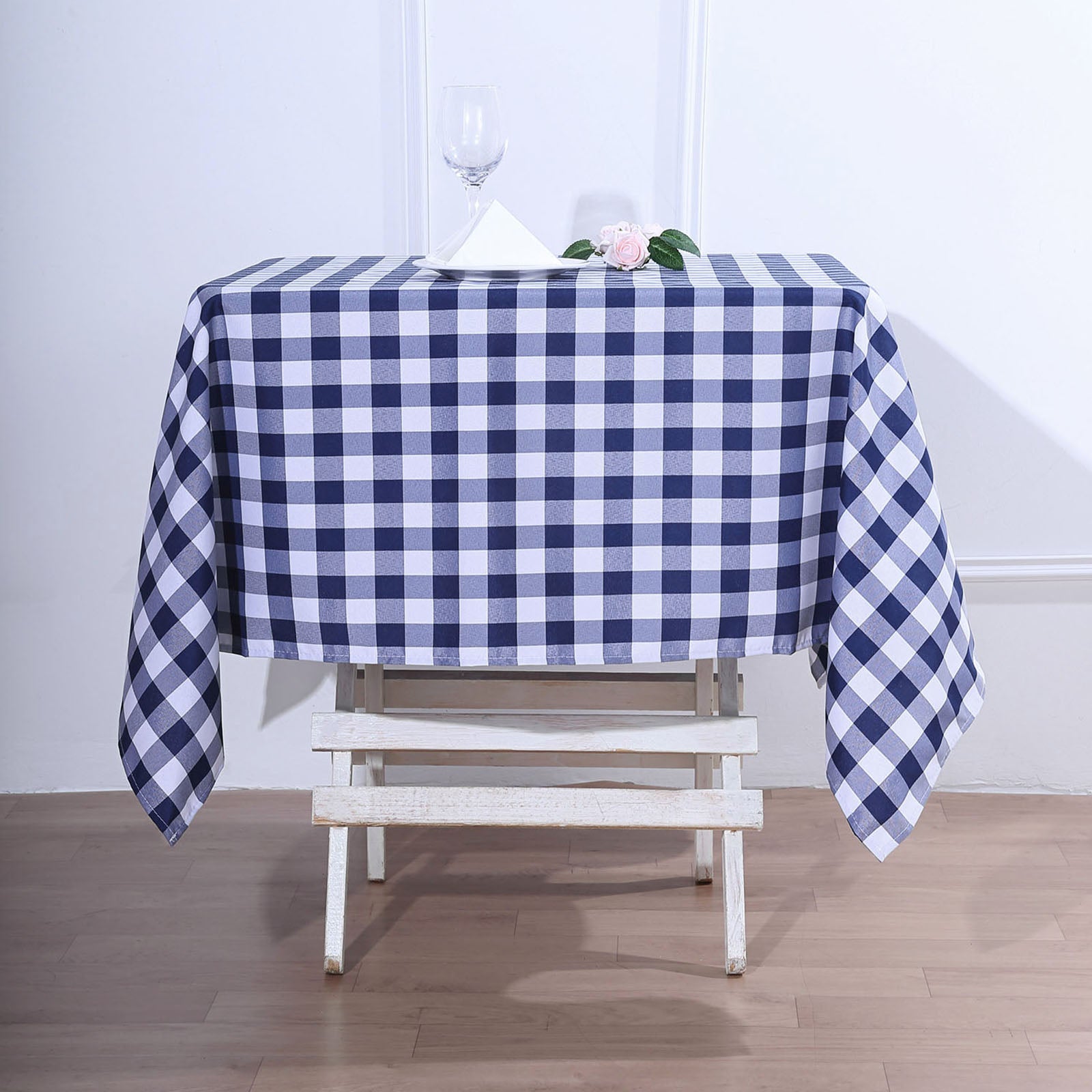 White/Navy Blue Buffalo Plaid Square Table Overlay on a White Table