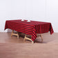 Black and red buffalo plaid tablecloth on a wooden table.