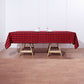 Black and red buffalo plaid tablecloth on a wooden table.
