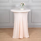 Blush spandex round cocktail table cover with natural wavy drapes.
