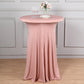 Dusty rose round cocktail table cover with wavy drapes.
