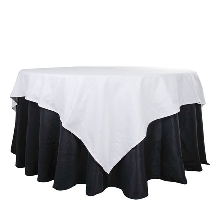 90" White Square Cotton Table Overlay Tablecloth on a black table.