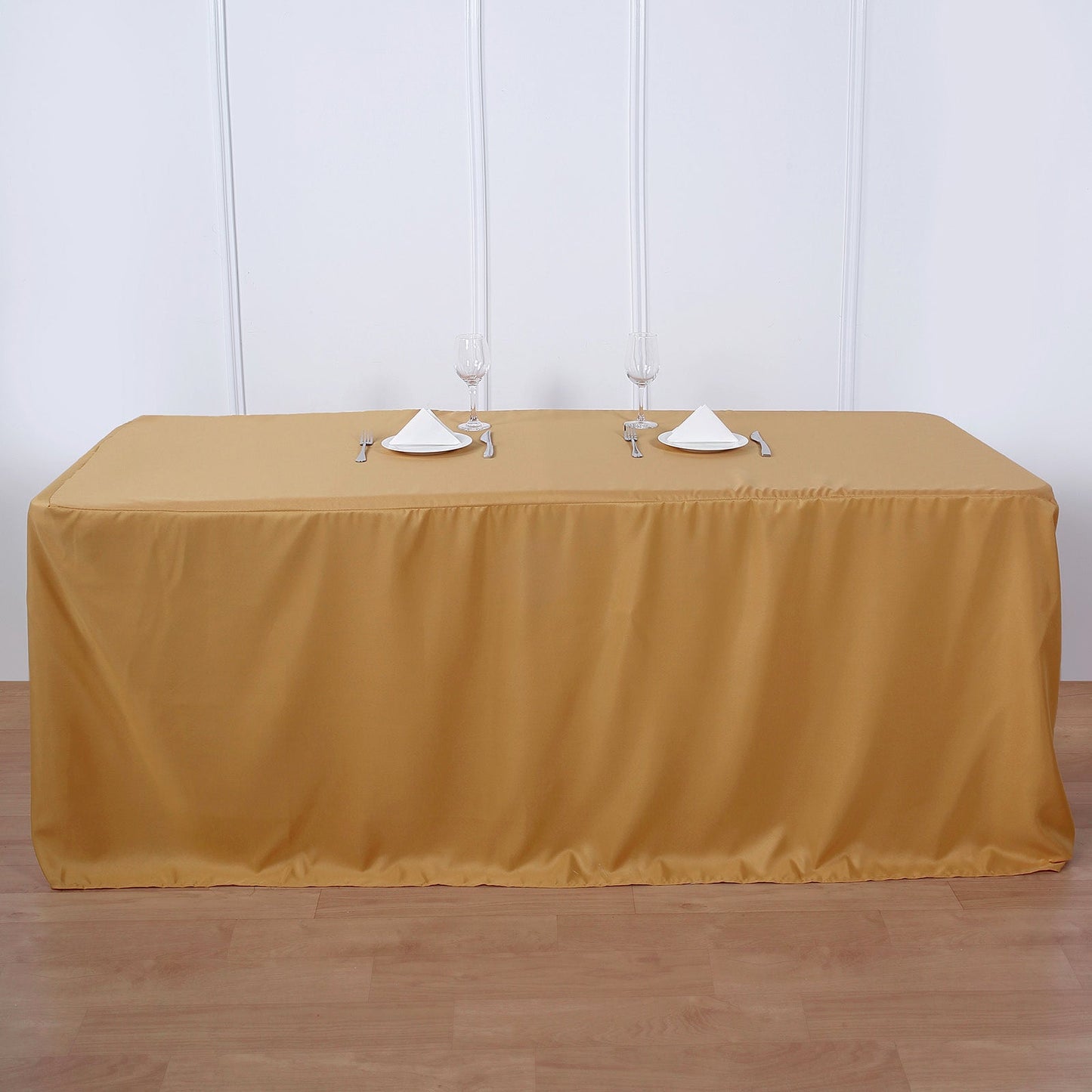Gold polyester rectangle tablecloth for 8ft tables, perfect for events.