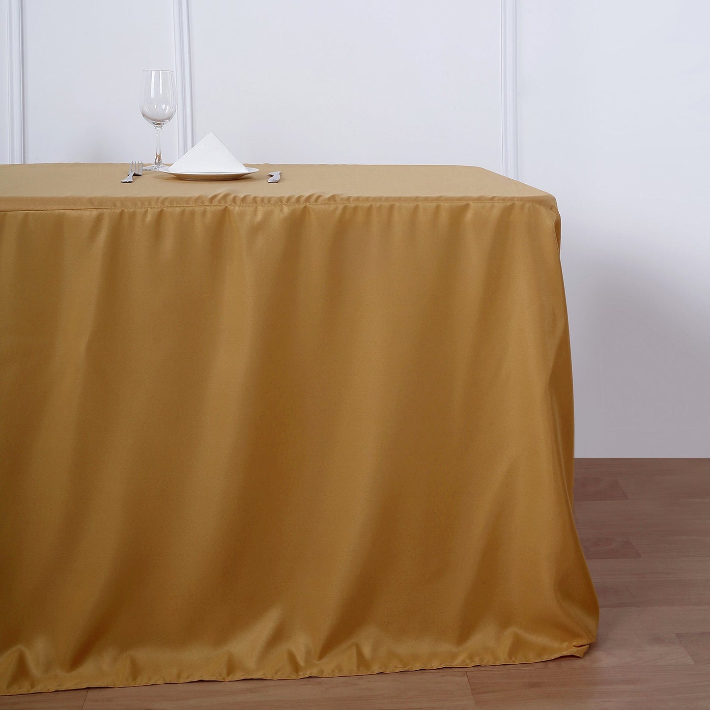 Gold fitted polyester tablecloth for 8ft tables.