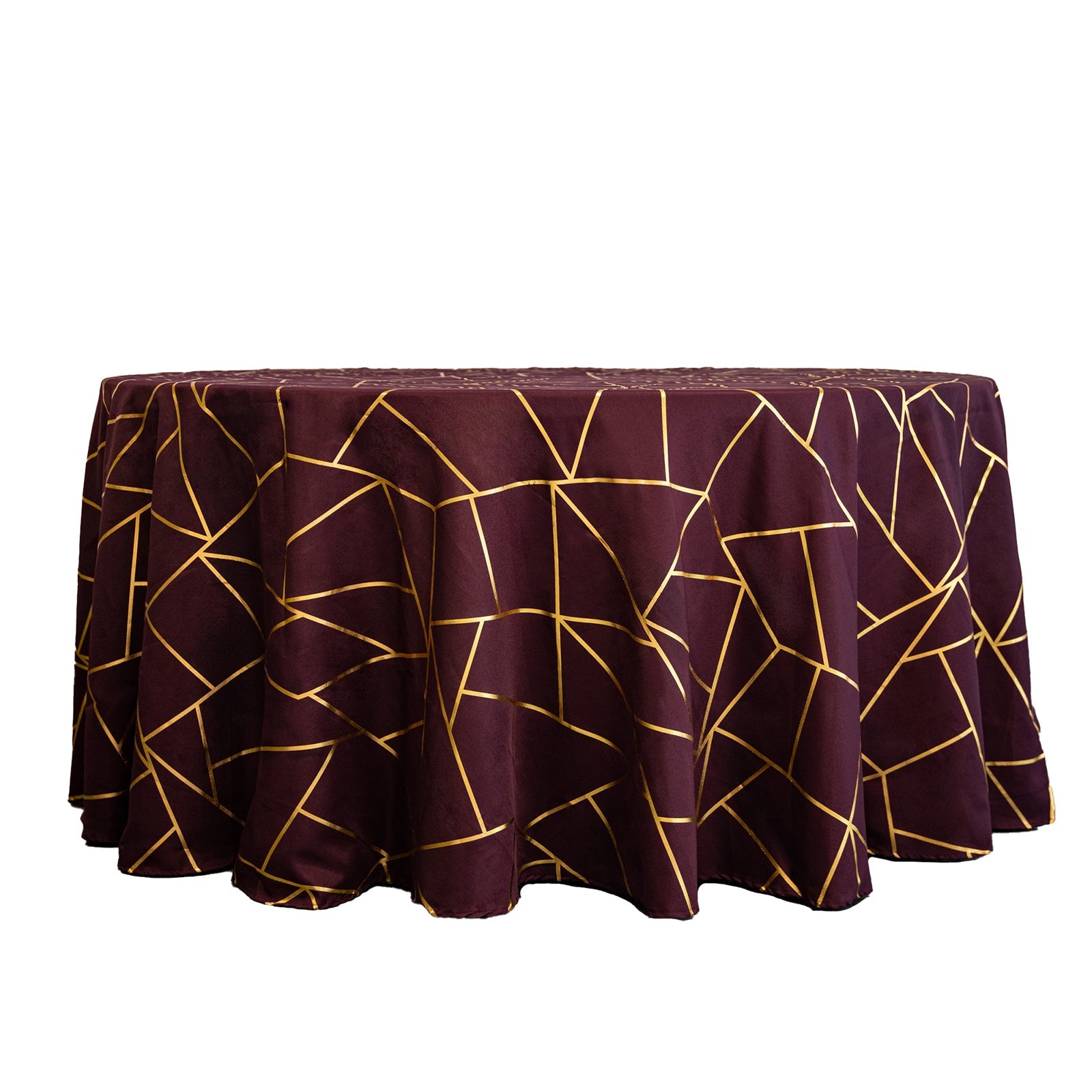 Burgundy round tablecloth with gold foil geometric pattern.