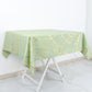 Sage green square table overlay with gold foil geometric pattern.