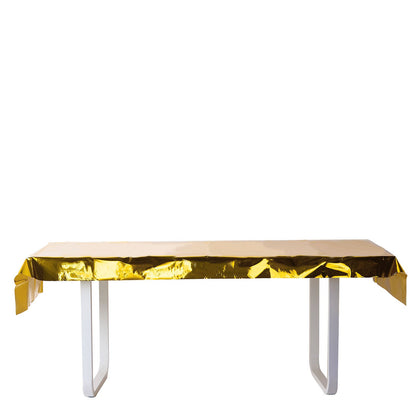 Gold metallic foil rectangle tablecloth on a white table.