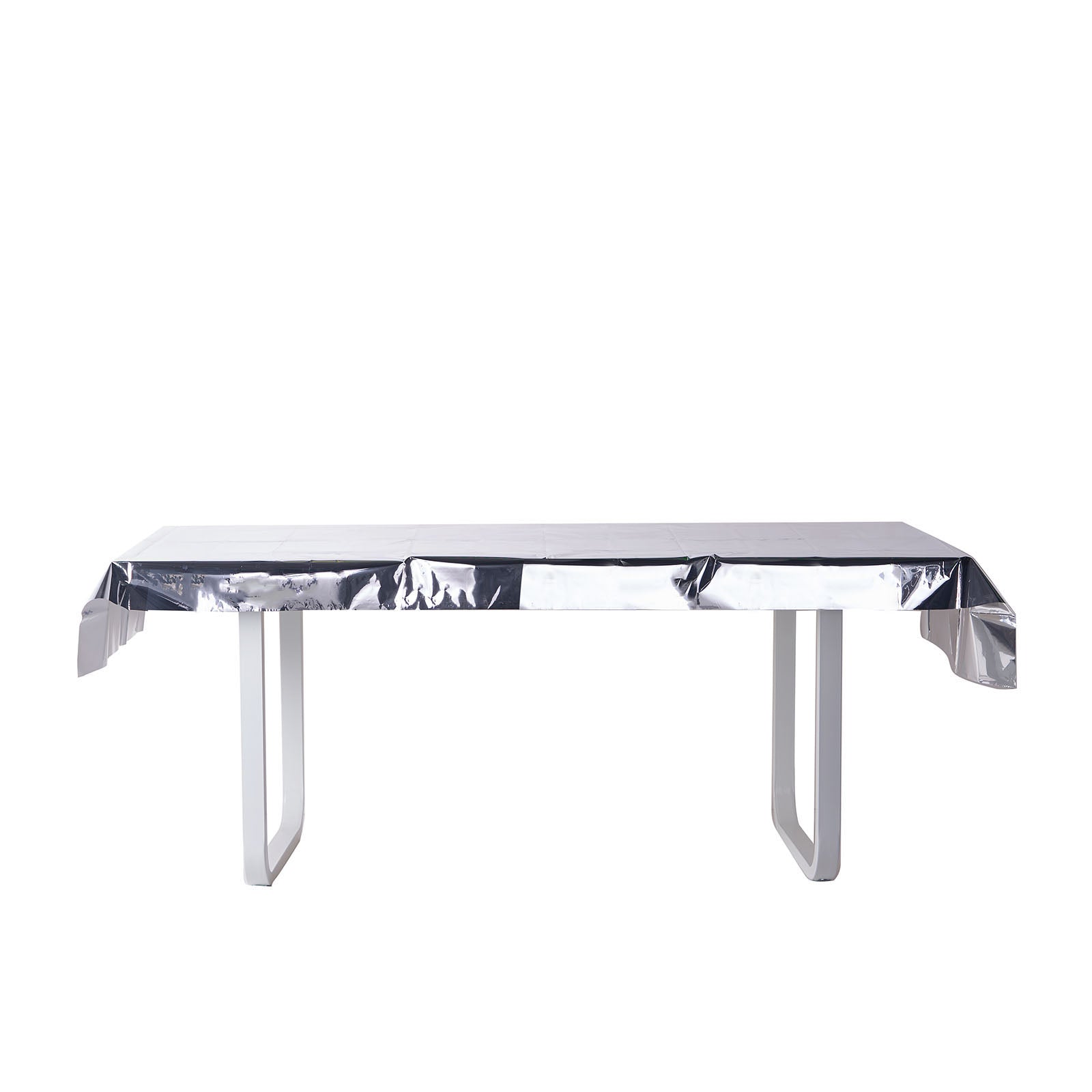 Silver metallic foil rectangle tablecloth on a white table.