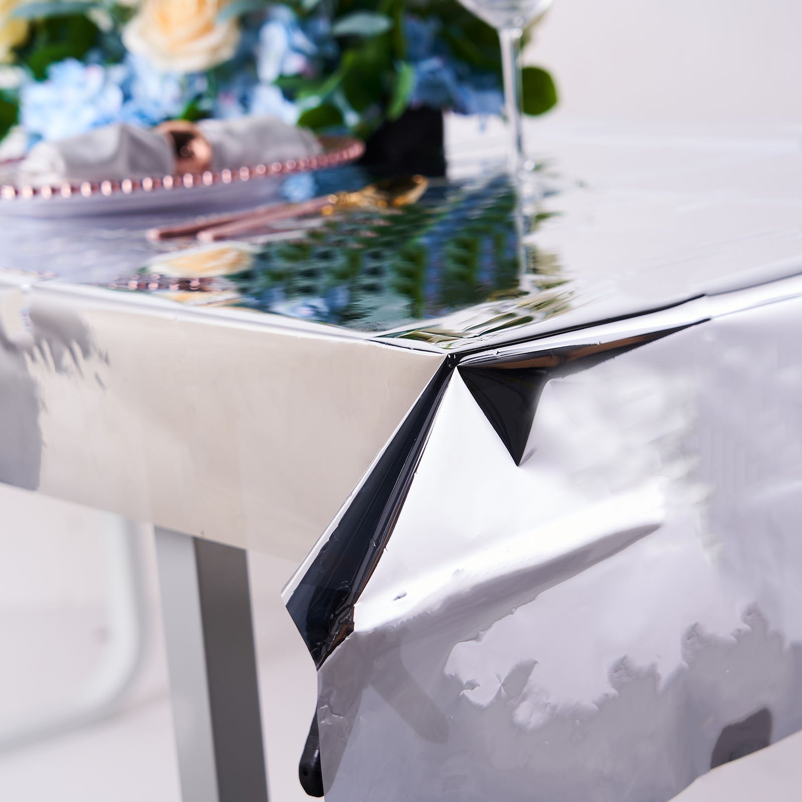 Silver metallic foil tablecloth on a dining table.