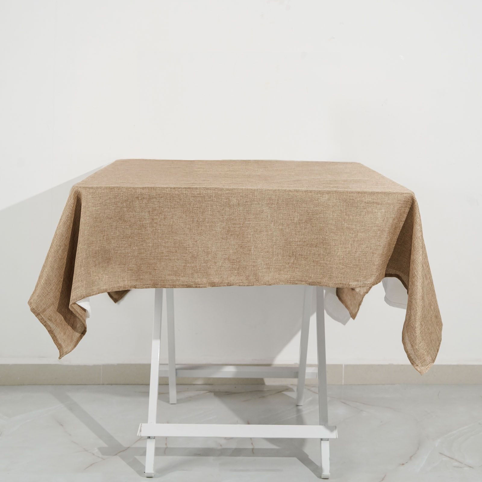 Natural faux burlap square table overlay in a boho chic style.