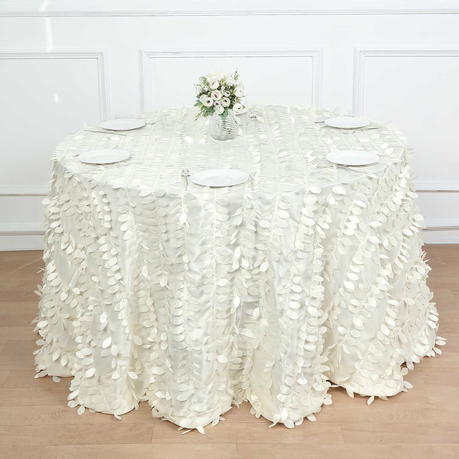 Ivory leaf petal taffeta round tablecloth on a wooden table.