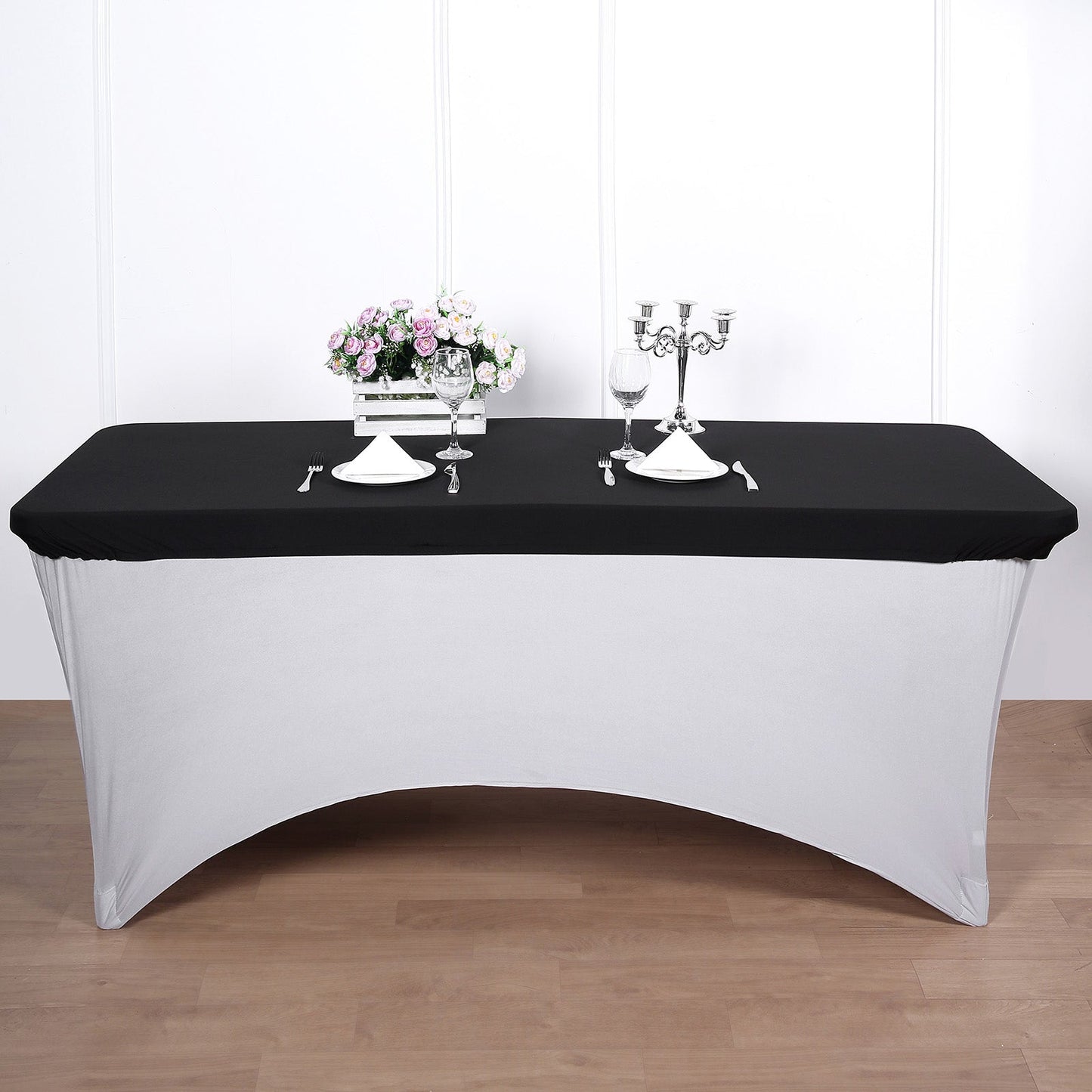 Black stretch spandex fitted table cover for 72"x30" tables.