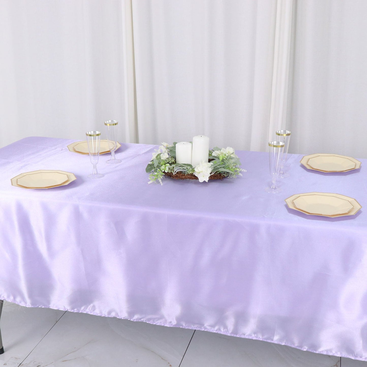 Lavender lilac smooth satin rectangular tablecloth on a dining table.