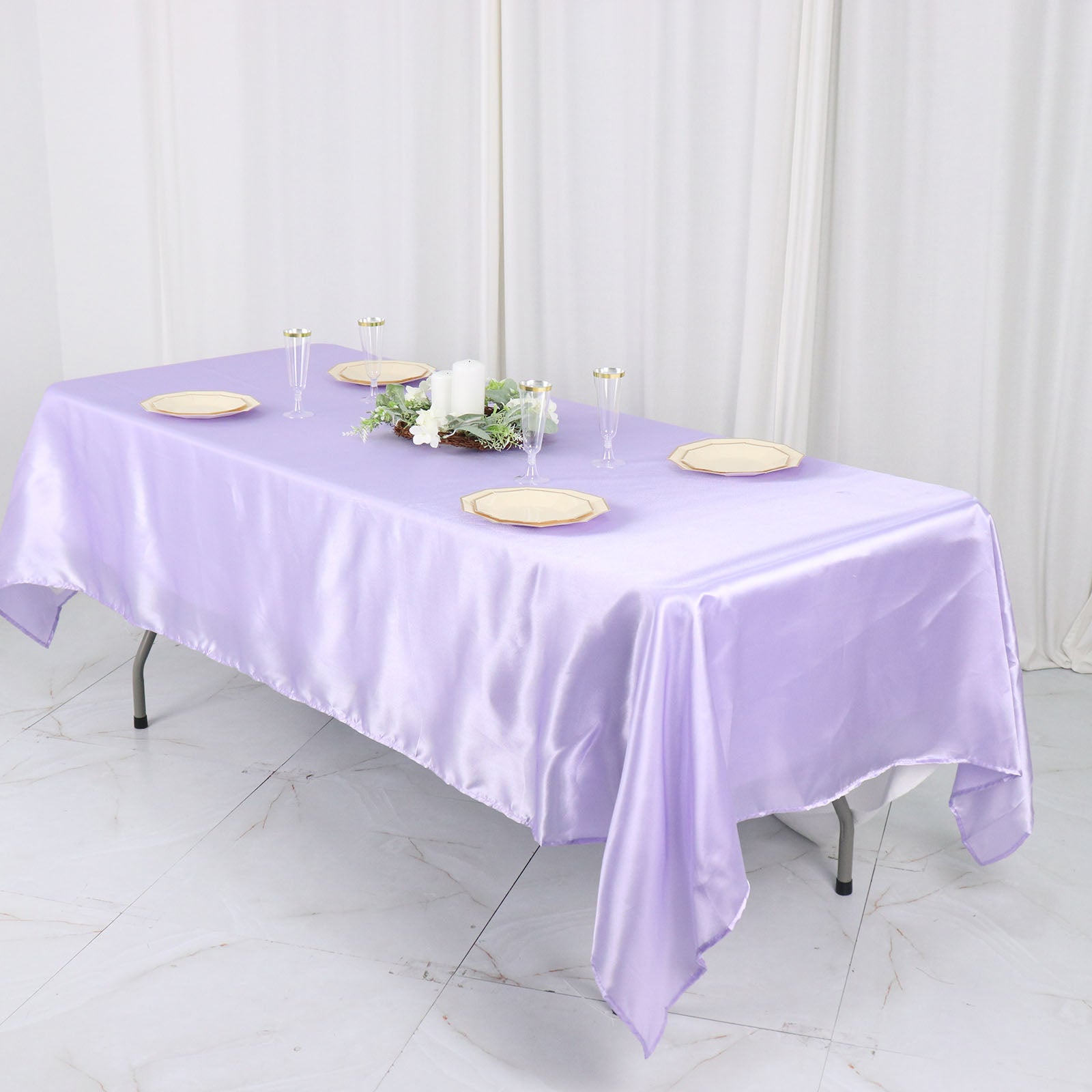 Lavender satin rectangular tablecloth on a dining table.
