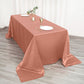 Terracotta satin rectangular tablecloth on a wooden table setting.