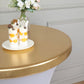 Metallic gold cocktail table cover with desserts on top.