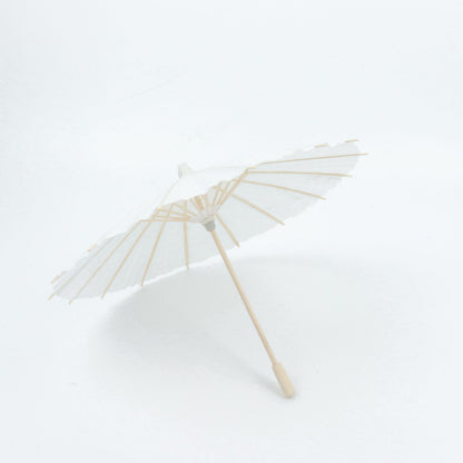 White bamboo parasol umbrella for weddings and parties.